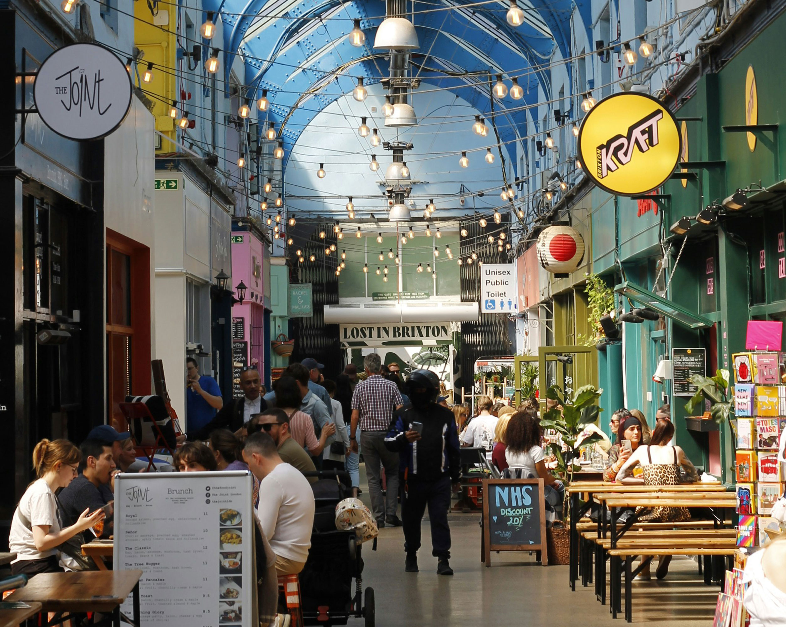 Busy arcade with cafes and restaurants
